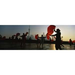  Silhouette of a Group of People Dancing in Front of Pudong 