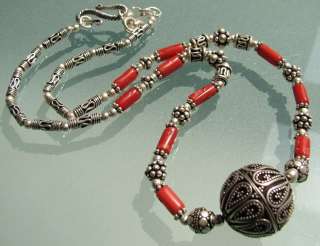 This is a pretty Bali style necklace with ornate silverwork beads and 