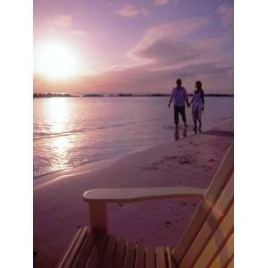  Couple Walking Along Beach at Sunset, Nassau, Bahamas 