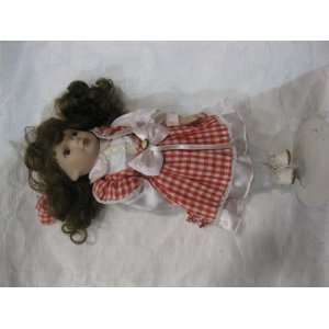    Porcelain Doll With Red Plaid Dress and Brunett Hair Toys & Games
