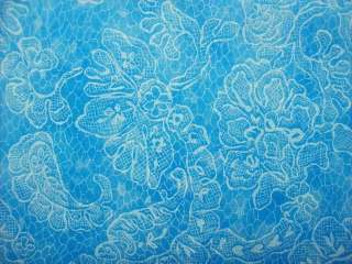 Bright blue background with a very pale light blue pattern of flowers 
