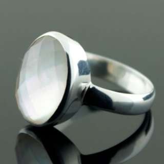 this is a sweet mother of pearl ring with a faceted quartz top this 