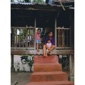  Stilt House and Local Family in Traditional Malayan 