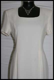   style sheath dress, fully lined, short sleeve, back zip & hook closure