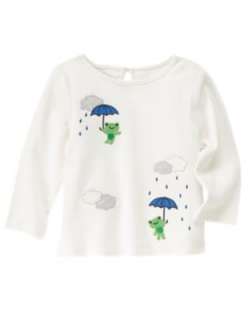 White long sleeve frog top and navy fleece pants with daisy dangles at 
