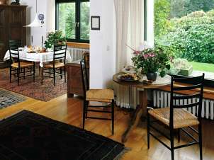 Open floor plan with dining table and breakfast table