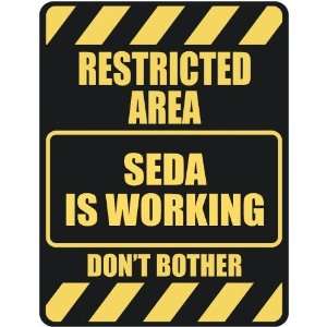   RESTRICTED AREA SEDA IS WORKING  PARKING SIGN