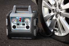   Portable Power System 450 Plus being used to inflate a flat tire