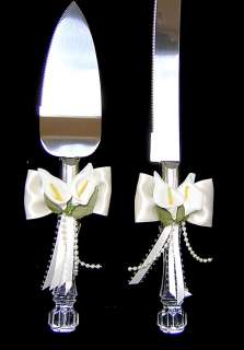   mini calla lilies accented with ivory satin ribbon and ivory pearl