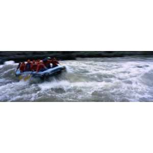  Group of Whitewater Rafters Work in Unison Stretched 